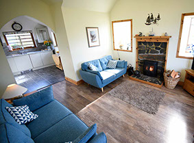 Our Self Catering Accommodation in Waternish contains a Woodburning stove and Open Plan Kitchen Living Room